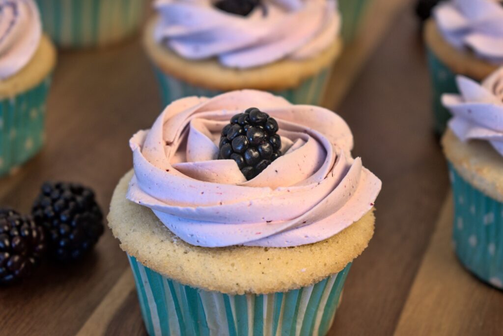 dairy-free vanilla bean cupcakes with blackberry buttercream