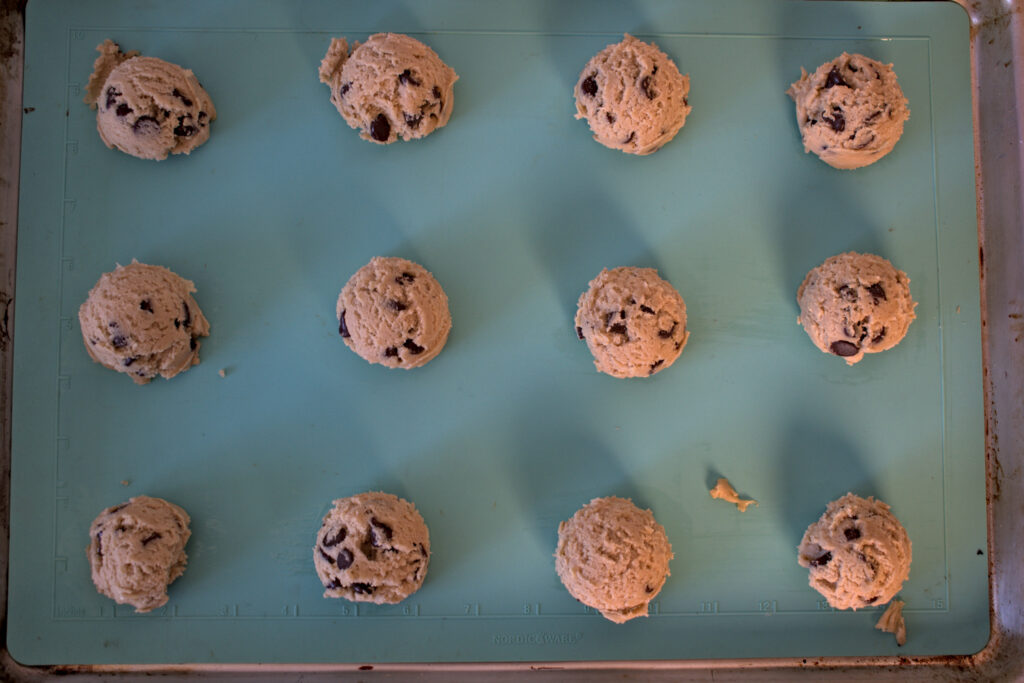 chocolate chip cookie dough on baking tray